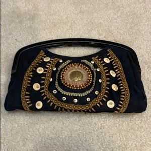 Black clutch with wood-like handle